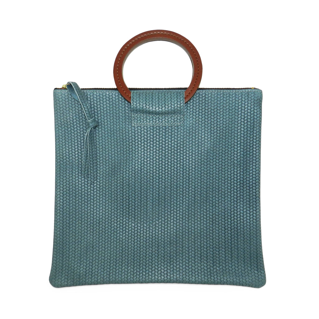 jolie clutch with handmade leather handles in ocean woven leather